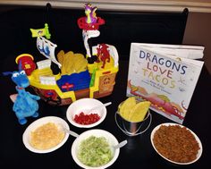 the table is filled with toys and snacks