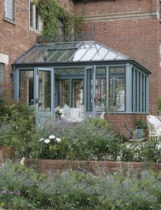 an orange brick building with a glass roof