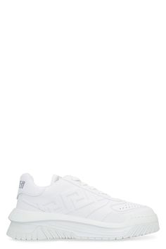 Elevate your casual footwear game with these luxurious ODISSEA sneakers from Versace. Crafted from premium leather, these sneakers feature the iconic tone-on-tone embossed Greca motif, adding a touch of sophistication to your ensemble. The fabric logo patch on the tongue, front lace-up closure, and perforations on the toe showcase the brand's attention to detail and commitment to quality. Complete with lettering print on the heel tab, rear embossed logo, fabric interior with a removable leather Fabric Logo, Sneaker Games, Versace Men, Leather Cap, Embossed Logo, White Sneakers, Lanvin, Sneakers White, Mens Shoes Sneakers