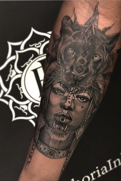 a man with a wolf tattoo on his arm