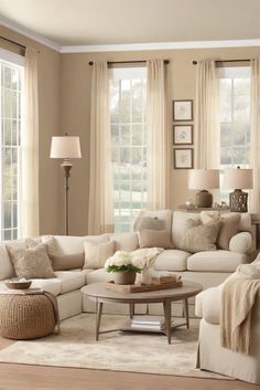 a living room filled with lots of furniture next to two windows and a rug on the floor