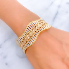 This 22k gold bangle stands out with its vibrant and majestic design, showcasing a beautiful combination of yellow, white, and rose gold finishes. The piece boasts a substantial weight of 37.00 grams, highlighting its premium quality and craftsmanship. With a size of 2.7 and an opening of 2.45 inches, it ensures a comfortable and secure fit for those with larger wrist sizes. This single bangle is an embodiment of luxury and elegance, making it an ideal choice for individuals who appreciate the i White Gold-plated Bangle Bracelet, Single Bangle, 22k Gold Bangles, Gold Bangle, 22k Gold, Gold Bangles, Gold Finish, Yellow White, Premium Quality