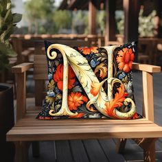 a wooden bench with a decorative pillow on it's back and the letter n