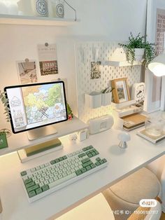 a white desk with a computer on it