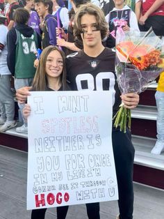 two young people standing next to each other holding flowers and a sign that says, i can't brothers nether is you for one