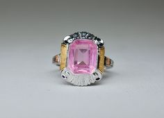 10k Edwardian Pink Czech Crystal Glass Ring, Bezel Set, by Van Dusen & Stokes, White Gold, Size 5.25 (Size 5 1/4), circa 1920s, 2.97 grams. Lovely Edwardian ring in 10k white gold with a pink crystal glass gemstone.  The pink gemstone has an almost electric look indicating it is more than like Czechoslovakian (Bohemian) glass.  The large pink gemstone bezel set in an open backed frame of white gold with feminine swirls and flounces at the top and bottom.  The sides feature a finely textured laye Art Deco Pink, The Ring Face, Edwardian Ring, American Jewelry, Vintage Style Rings, Czech Crystal, Glass Rings, Jewelry Manufacturers, Pink Gemstones