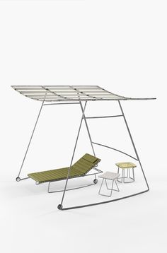 an outdoor swing chair and table in front of a white background