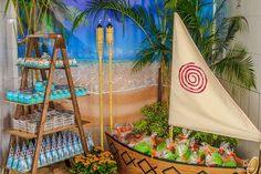 a display in a store filled with lots of food and drinks next to a sailboat