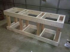 the unfinished table is ready to be built and put into place in the garage area