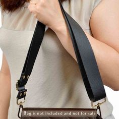 Replacement Guitar Style Strap For Designer Bags!Refresh your bags and purses with our chick guitar-style straps. This fashionable dark gray strap is suitable for any size bag. You can attach it to your handbags, tote bags, purses, clutches, accessory wallets, and more… It is designed to fit well with many types of handbags.The guitar-style strap is adjustable for shoulder and crossbody positions. It is comfortable to wear with its soft-to-touch nylon material and wide size.We offer various opti Black Adjustable Handle Crossbody Bag Strap, Detachable Rectangular Black Shoulder Strap, Black Detachable Strap Shoulder Strap, Adjustable Logo Strap Travel Bag, Adjustable Crossbody Bag With Logo Strap, Travel Bags With Adjustable Logo Strap, Black Bag Strap With Adjustable Handle, Black Adjustable Bag Strap For Daily Use, Adjustable Black Bag Strap For Everyday Use