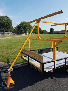 a trailer that is sitting in the middle of a road with a ramp attached to it