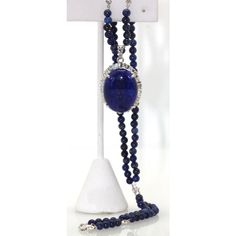 This is part of Chairish’s Fine Jewelry assortment.  LENGTH: 18″ chain, 22″ with pendant DIMENSIONS: Pendant is 30mm x 30mm STONES: Lapis lazuli beads, 4.5mm STONES: Diamonds, 2 ct surround, .8 ct accents, clarity SI1, color G, total 2.8 cts METAL: 18k white gold CONDITION: New  Lapis & Diamond Pendant 18K Beaded Lapis Chain. This extra fine quality lapis lazuli pendant is 25mm in a 30mm 2 carat diamond surround mount. Also, the 4.5mm lapis beads are strung on an 18k white gold chain, which is s Luxury Beads, Gems, And Cabochons For Formal Occasions, Formal Lapis Lazuli Jewelry, Luxury Oval Gemstone Beads Jewelry, Luxury Formal Gemstone Beads Necklace, Luxury Long Gemstone Beads Necklace, Elegant Gemstone Beads Pendant Jewelry, Luxury Formal Beaded Necklaces With Polished Beads, Luxury Polished Beads Necklace For Formal Occasions, Luxury Polished Beaded Necklaces For Formal Occasions