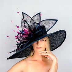 Absolutely stunning this oversized off center brim hat will make a statement anywhere you go Made of a top grade sinamay fabric and adorned with handmade flower and hand trimmed and hand dyed feathers Made to order! Please order 2-3 weeks in advance prior to your event! Rushed orders are possible, please discuss! This one is done in navy and pink , but taking orders for a wide variety of colors. This hat will definitely make a statement anywhere you go!! One size fits all! please be aware- since all the pieces are handmade and not done on a machinery  and also due to the nature of crinoline and it's movement, it can slightly vary in a design. Not returnable due to the nature of this product All hats are custom made to fit your head size Crazy Kentucky Derby Hats, Derby Hats Diy Ideas, Derby Attire, Classy Hats, Tea Hats, Large Hat, Derby Outfits, Navy Hat, Oversized Hat