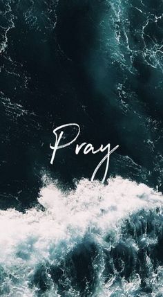 the word pray written in white on top of an image of rough blue ocean waves