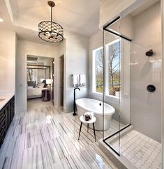 a bathroom with a tub, sink and shower in the middle of it's walls