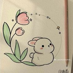 a drawing of a little bunny with flowers on it's back and a pencil in the foreground