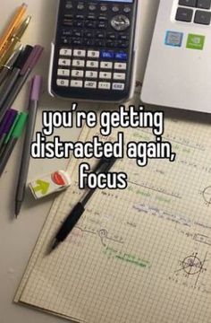 there is a calculator, pencils and other items on the desk with words that say you're getting distracted again