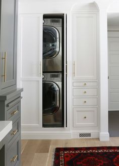 a washer and dryer in a white room