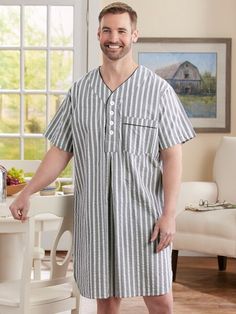 Our seersucker cotton nightshirt is offered in three striking color combinations - brick red with blue and white stripes, navy with green and white stripes, natural with navy and white stripes - a nice change from the traditional blue and white. Plus, this oversized shirt is tailored for many night's of comfort with a V-neck, button placket, chest pocket, and shirttail hem. Cool, all-cotton seersucker Classic style with a relaxed fit Single chest pocket Approx. 42" long 100% cotton Machine wash and dry Imported Exclusive to The Vermont Country Store | Men's Striped Cotton Seersucker Nightshirt - Navy - Large - The Vermont Country Store Striped Cotton Short Sleeve Sleepwear, Cotton Sleepwear With Vertical Stripes For Loungewear, Striped Cotton Sleepwear For Home, Vermont Country Store, Mens Stripes, Country Store, Brick Red, Night Shirt, Oversized Shirt