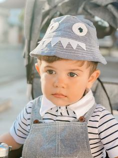 Are you looking for cloth for the little boy or a gift for your friend? This smart and casual-looking set is good for your little boy. Made of high-quality combed cotton material. The material is soft and highly absorbent, and it is gentle against a baby's skin. The set is inclusive of a cute monster hat, overalls, and a jumpsuit. It's easy to get dressed and take off with a button. It's the perfect gift for a birthday, Christmas, or any occasion. Influencer @baby.amarbizhdili Material: Cotton C Playful Cotton Bucket Hat For Playtime, Adjustable Cotton Bucket Hat For Play, Spring Casual Bucket Hat For Playtime, Adjustable Cotton Bucket Hat In Playful Style, Playful Adjustable Cotton Bucket Hat, Cotton Hat With Curved Brim For Playtime, Adjustable Cotton Bucket Hat For Playtime, Gray Brimmed Cotton Hat, Cotton Bucket Hat With Curved Brim For Playtime