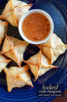 baked crab rangoon with sweet chili sauce served on blue plate, ready to be eaten