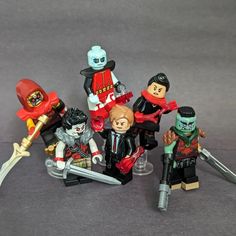 a group of lego figurines that are all dressed in different costumes and outfits