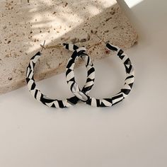 Black And White Leather Oval Hoop Earrings. Trendy White Round Hoop Earrings, Chic White Round Hoop Earrings, Black Round Summer Jewelry, Chic Small White Hoop Earrings, Black Hoop Jewelry For Summer, Summer Black Hoop Jewelry, Chic Black Hoop Earrings, Chic Black Earrings For Summer, Trendy Small Black Hoop Earrings