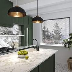 a kitchen with marble counter tops and green cabinets, two hanging lights above the stove