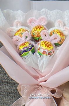 a bouquet of candy wrapped in pink ribbon