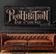 the smiths prohibition bar and lounge sign is displayed on a wall above a leather couch