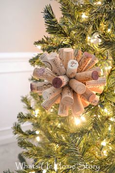 a wine cork ornament hanging from a christmas tree