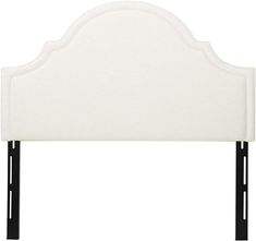 an upholstered headboard with black legs and white fabric on the top side