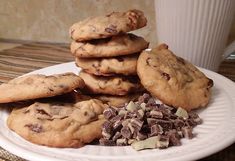 a white plate topped with cookies and chocolate chips