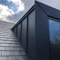 the roof of a building with a sky background