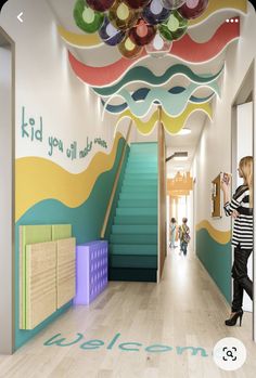 an artist's rendering of the entrance to a child's playroom with stairs and painted walls