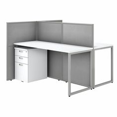 an office desk with two cubicles on each side and one door open to the other