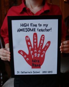 a person holding up a sign that says high five to my awesome teacher, mrs rose