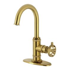 an antique brass faucet with two handles and nozzles on the side