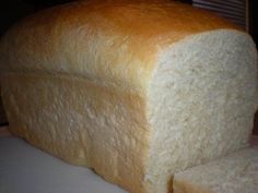 a loaf of white bread sitting on top of a counter