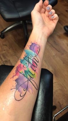 a woman's arm with a tattoo that reads, believe on it and the word love