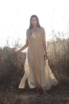 The Jala dress is a modern take on a Grecian inspired romantic feminine style. A beautifully light transparent silk dress that you can get creative layering with your favourite pieces. One Size| AUS 6 - 12 UK 6 - 12 US 2 - 8 EU 34 - 40 Fit | Will drape more on thinner frame Will drape less on fuller frame Paired with | Champagne Rose Slip Note| This fabric varies in shade when in different lights. Dress is transparent. Slip dress is sold separately Care | Please see care label for item specific Romantic Feminine Style, Lights Dress, Fashion Cape, Gold Silk Dress, White Raven, Cape Fashion, Champagne Rose, Boho Crop Tops, Boho Chic Dress