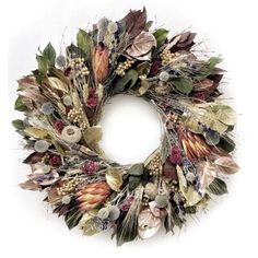 a wreath made out of dried flowers and leaves