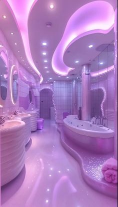 the bathroom is decorated in pink and white with circular lights on the ceiling, along with round tubs