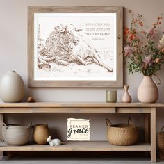 a wooden shelf with vases and other items on it next to a framed print