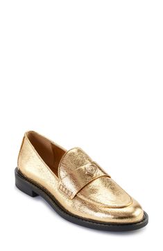 Elevate your everyday look with this prepster-classic loafer given eye-catching appeal by a shimmering golden finish. 1" heel Synthetic upper, lining and sole Imported Classic Gold Loafers With Round Toe, Classic Gold Slip-on Loafers, Elegant Gold Flat Loafers, Classic Gold Loafers For Work, Classic Gold Loafers For Office, Classic Gold Flat Heel Loafers, Gold Slip-on Loafers For Office, Classic Gold Loafers With Flat Heel, Gold Classic Loafers With Flat Heel