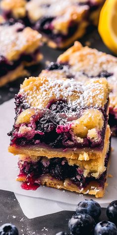 blueberry lemon bars stacked on top of each other