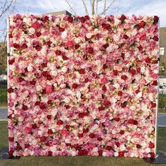 a large flowered wall in front of a building