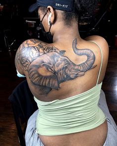 a woman with a tattoo on her back