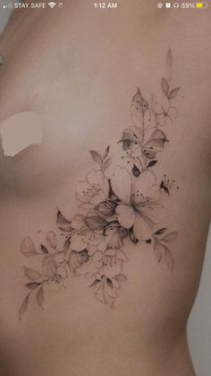 a woman's stomach with flowers on it