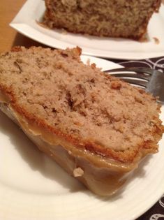 two slices of banana bread on white plates